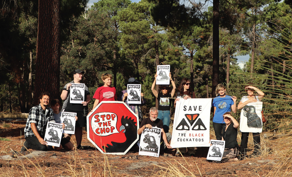 People with banners in the forest